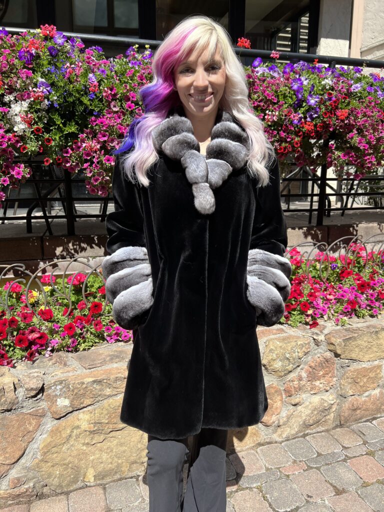 This dyed black sheared mink coat with natural chinchilla trim is beautiful and timeless. It is perfect for special occasions or adding a touch of...