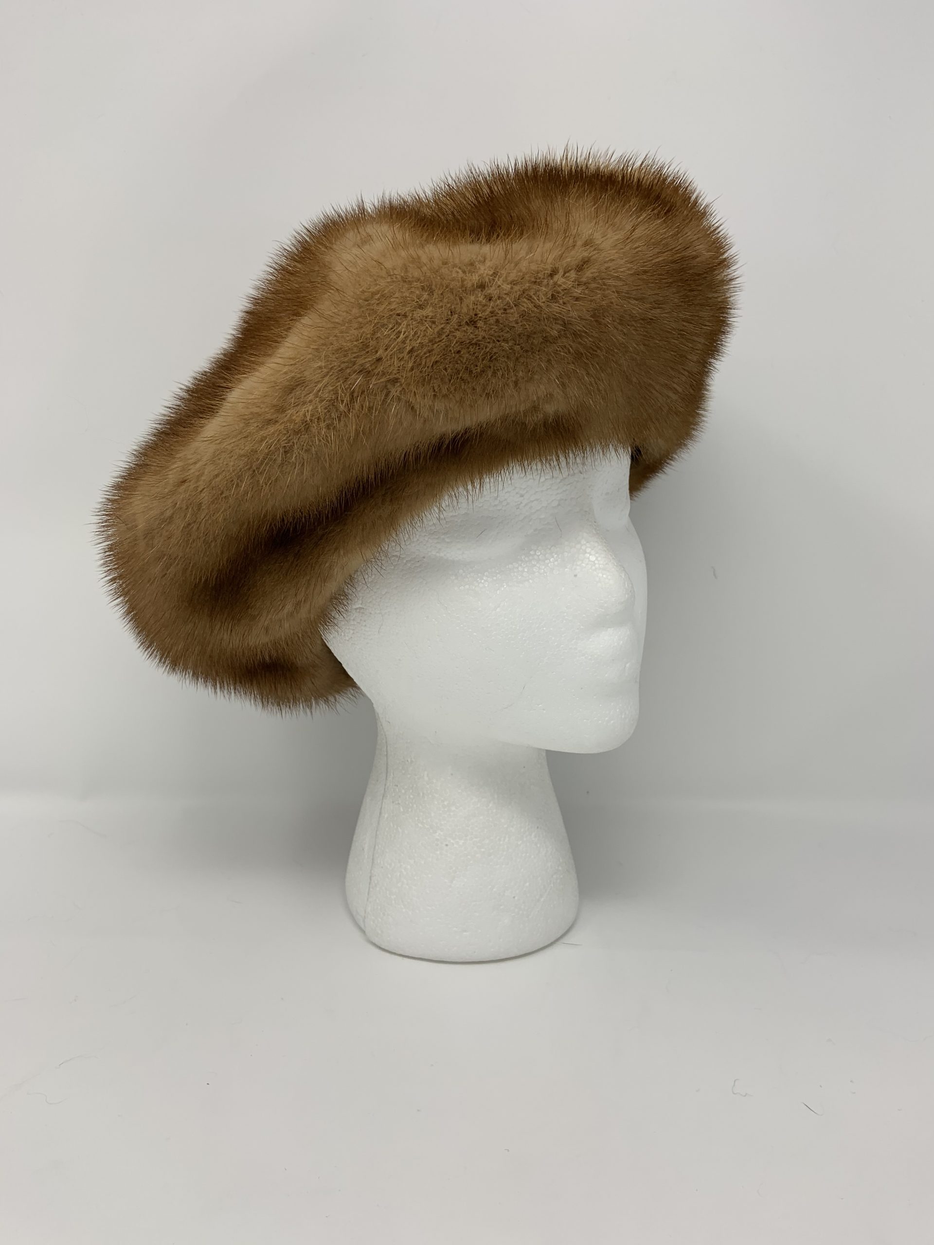 IMG_1830-scaled-1.jpg Our dyed whiskey mink fur beret is a chic and sophisticated accessory for any winter look. Crafted from mink fur dyed in a rich whiskey hue, this beret combines elegance with the plush comfort of fur.