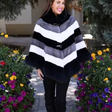 Our tri-color mink cape with fox trim combines sleek mink fur with soft fox trim. It offers a stylish and cozy layer, perfect for enhancing any outfit.