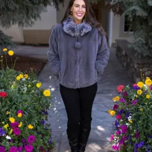 This dyed blue iris mink zip-up jacket with indigo fox trim blends rich color with soft luxury. The blue mink creates a sleek base, while the indigo fox trim adds texture and warmth. This jacket enhances your style with elegance and keeps you cozy on colder days.