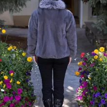 This dyed blue iris mink zip-up jacket with indigo fox trim blends rich color with soft luxury. The blue mink creates a sleek base, while the indigo fox trim adds texture and warmth. This jacket enhances your style with elegance and keeps you cozy on colder days.