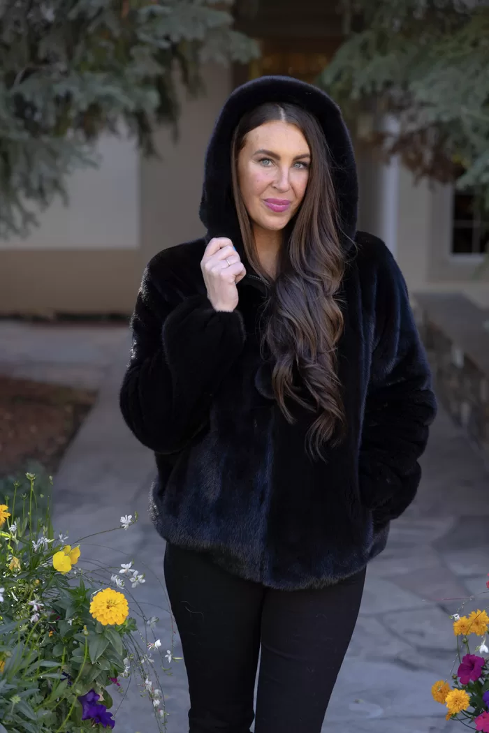 This black ranch mink zip-up jacket combines luxury with practicality. The sleek black mink fur adds elegance, while the zip-up design ensures ease and versatility. This jacket keeps you warm and stylish, making it a perfect choice for any occasion.