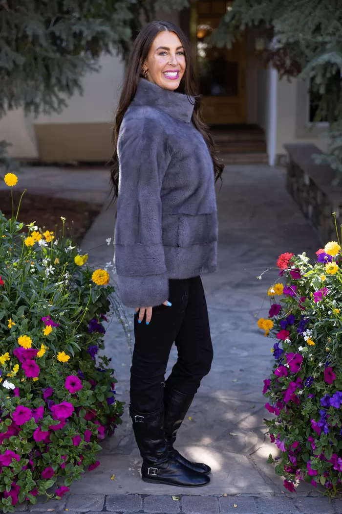 Our dyed blue iris mink coat offers warmth and elegance with its deep, rich blue tones. The mink fur provides a soft, luxurious feel, making it a stylish choice for cold weather. This coat enhances your wardrobe with a bold yet refined look, perfect for any occasion.