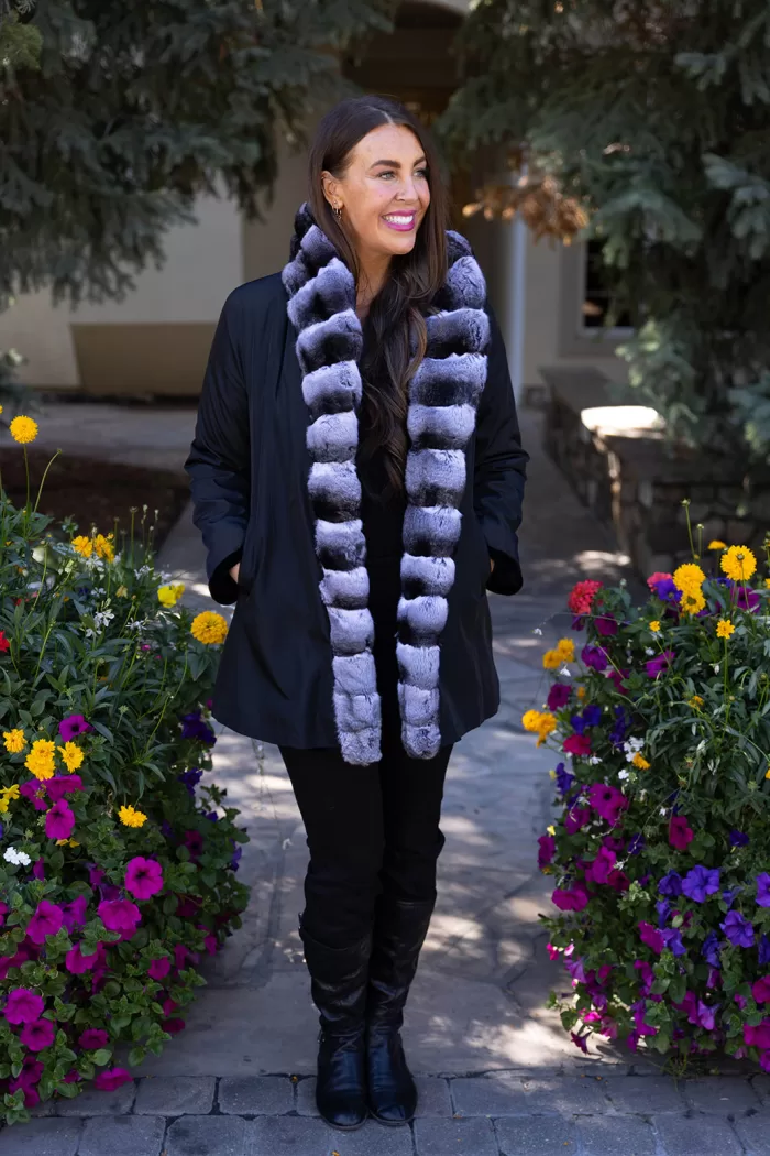 Our black reversible sheared mink coat with chinchilla trim combines luxury and versatility. The sheared mink offers softness and elegance. The chinchilla trim adds texture and sophistication. Its reversible design lets you switch styles effortlessly. This coat keeps you warm while enhancing your look for any occasion.