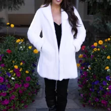 Our dyed white mink jacket combines elegance with cozy warmth. The pristine white fur enhances any outfit beautifully. Its soft texture provides comfort for any occasion.