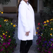 Our dyed white mink jacket combines elegance with cozy warmth. The pristine white fur enhances any outfit beautifully. Its soft texture provides comfort for any occasion.