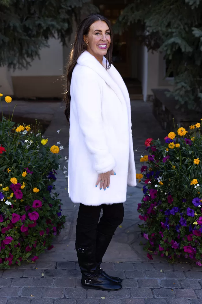 Our dyed white mink jacket combines elegance with cozy warmth. The pristine white fur enhances any outfit beautifully. Its soft texture provides comfort for any occasion.