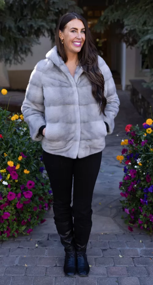 This sapphire mink jacket with a hood offers a sleek, classic look. The hood provides added warmth and comfort for any occasion.