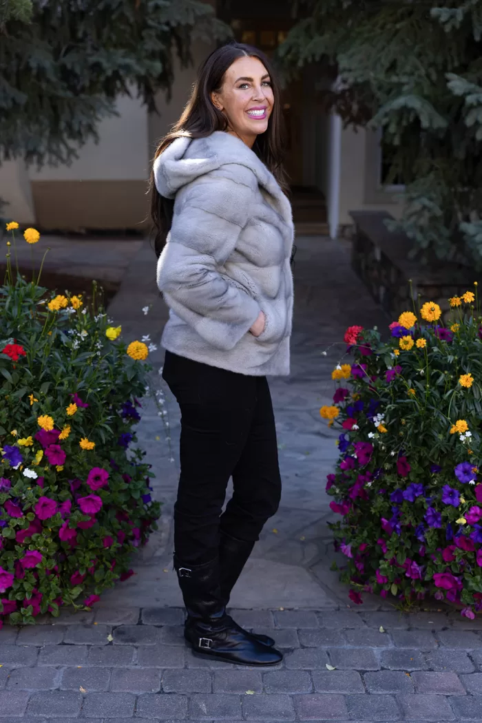 This sapphire mink jacket with a hood offers a sleek, classic look. The hood provides added warmth and comfort for any occasion.