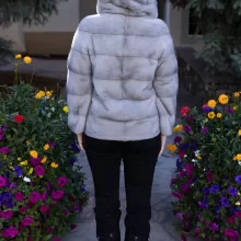 This sapphire mink jacket with a hood offers a sleek, classic look. The hood provides added warmth and comfort for any occasion.