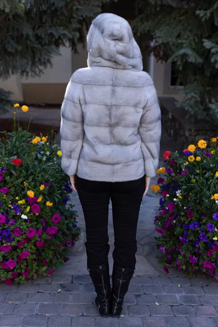 This sapphire mink jacket with a hood offers a sleek, classic look. The hood provides added warmth and comfort for any occasion.