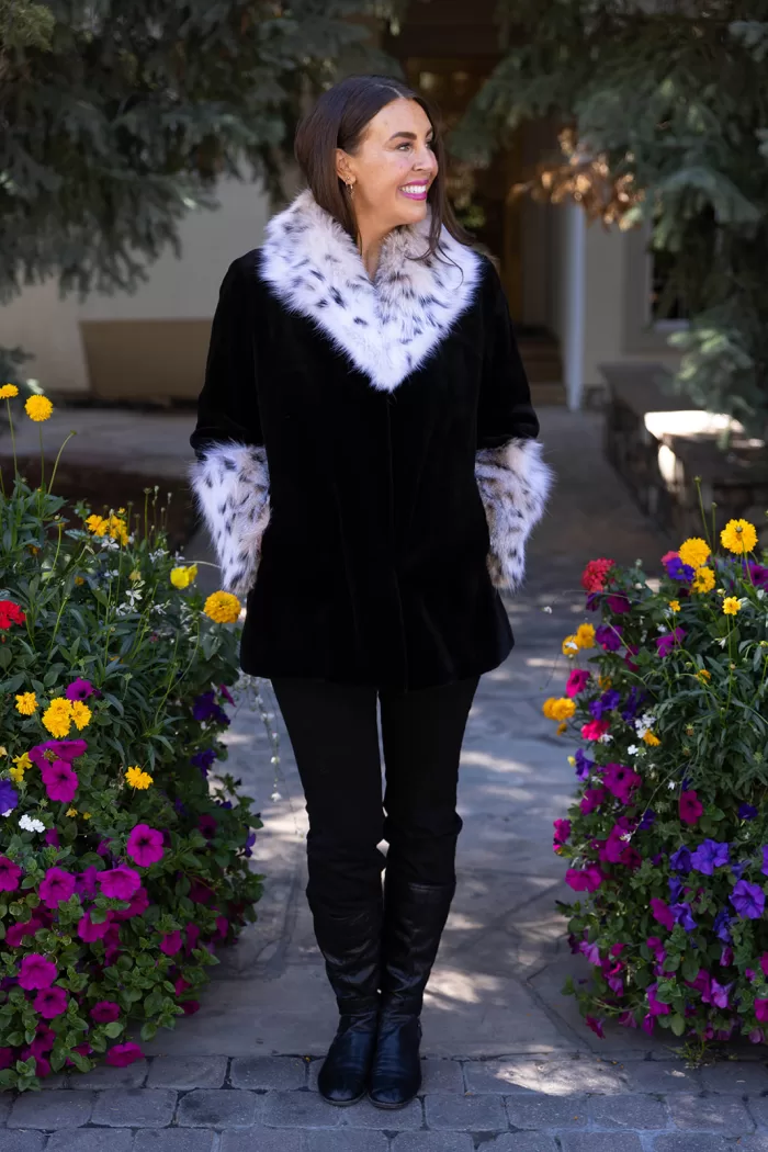 Our black sheared mink jacket with a natural lynx collar and cuffs combines sleek style with luxurious details. The soft black mink creates a smooth, elegant look, while the natural lynx adds texture and striking contrast. This jacket keeps you warm and stylish, making it a perfect choice for any winter occasion.