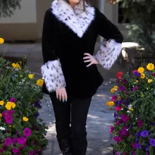 Our black sheared mink jacket with a natural lynx collar and cuffs combines sleek style with luxurious details. The soft black mink creates a smooth, elegant look, while the natural lynx adds texture and striking contrast. This jacket keeps you warm and stylish, making it a perfect choice for any winter occasion.