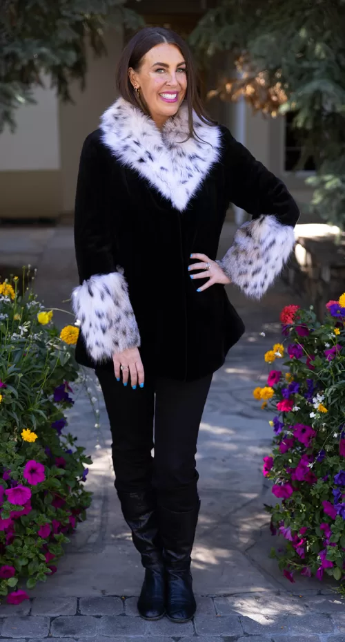 Our black sheared mink jacket with a natural lynx collar and cuffs combines sleek style with luxurious details. The soft black mink creates a smooth, elegant look, while the natural lynx adds texture and striking contrast. This jacket keeps you warm and stylish, making it a perfect choice for any winter occasion.