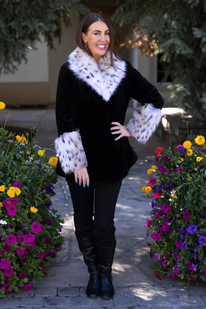 Our black sheared mink jacket with a natural lynx collar and cuffs combines sleek style with luxurious details. The soft black mink creates a smooth, elegant look, while the natural lynx adds texture and striking contrast. This jacket keeps you warm and stylish, making it a perfect choice for any winter occasion.