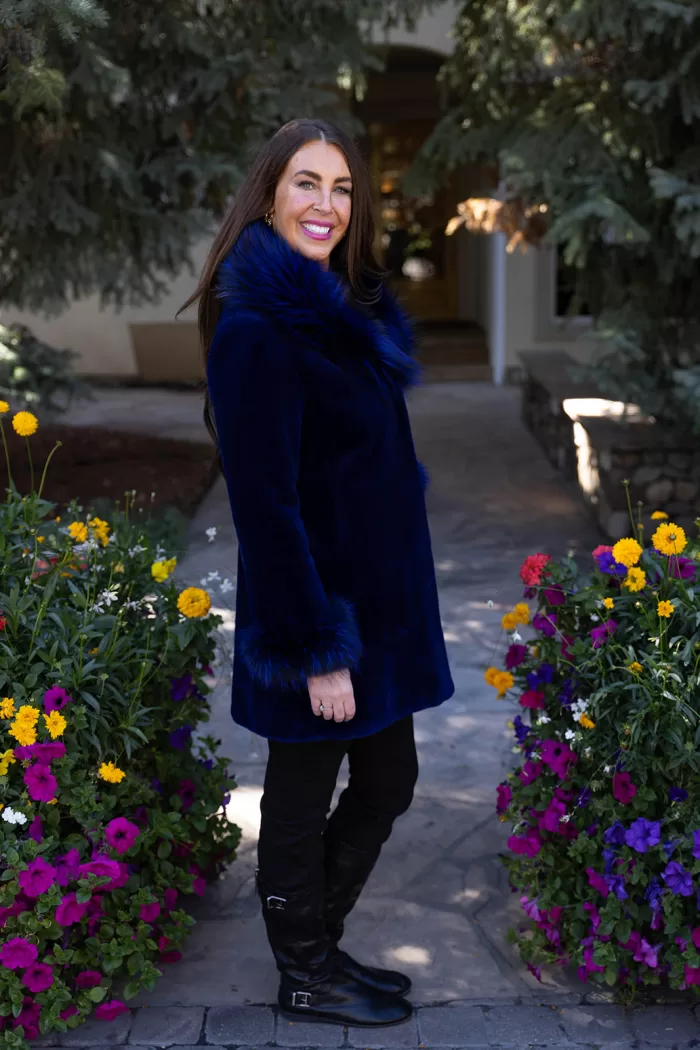 This dyed blue sheared mink stroller features a dyed blue silver fox collar and cuffs. Together, they offer bold style and cozy warmth. The sleek...