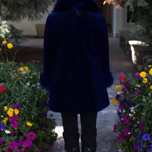 This dyed blue sheared mink stroller features a dyed blue silver fox collar and cuffs. Together, they offer bold style and cozy warmth. The sleek...