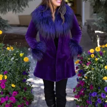 Our dyed purple sheared mink stroller with dyed purple silver fox combines bold color with luxury. Moreover, the soft mink offers warmth and elegance. The silver fox trim adds texture and a striking contrast. This stroller creates a stylish and vibrant look for any occasion.