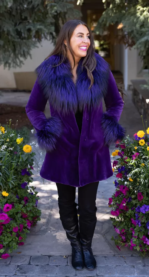 Purple sheared mink stroller with soft texture and vibrant fox trim collar and cuffs by Fantasia Furs.