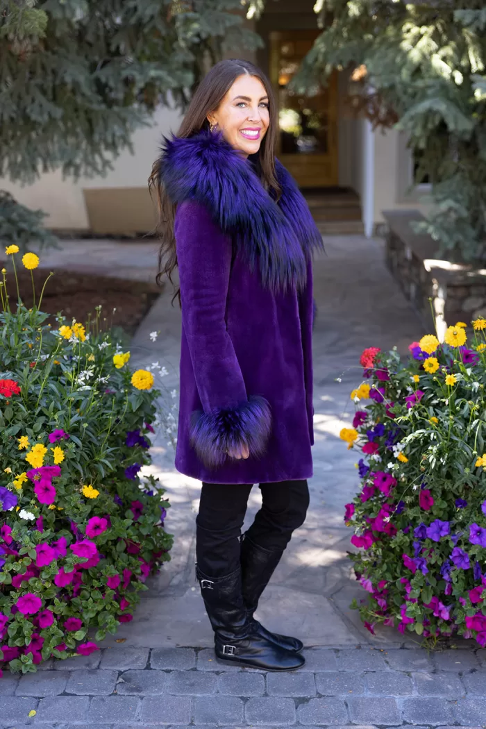 Our dyed purple sheared mink stroller with dyed purple silver fox combines bold color with luxury. Moreover, the soft mink offers warmth and elegance. The silver fox trim adds texture and a striking contrast. This stroller creates a stylish and vibrant look for any occasion.