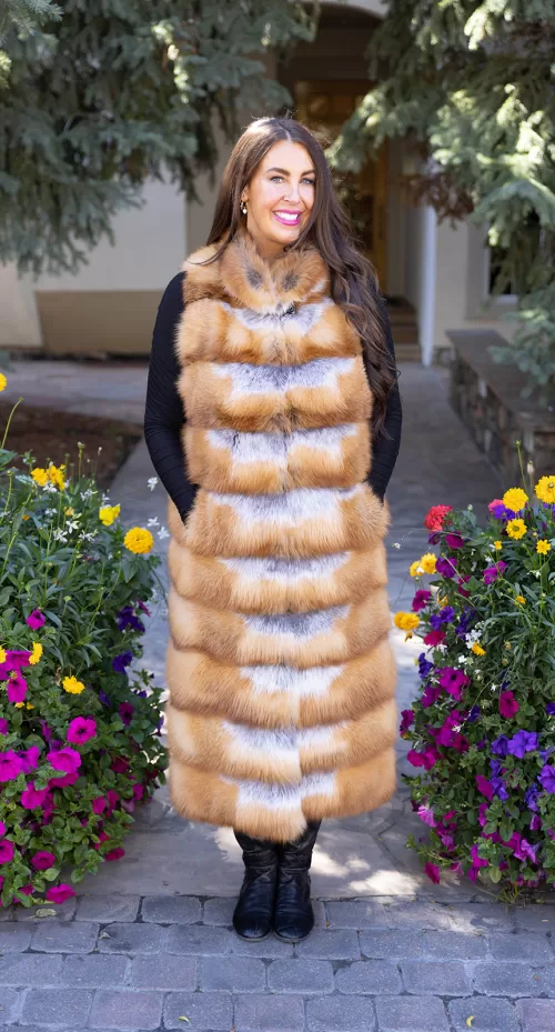 Natural red fox duster vest with a soft, fluffy texture and long, elegant design by Fantasia Furs.