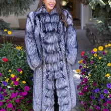 Natural silver fox coat with a plush, voluminous texture and full-length, luxurious design by Fantasia Furs.