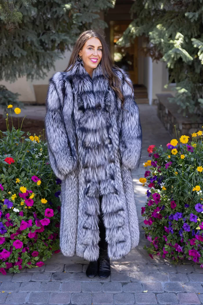 Natural silver fox coat with a plush, voluminous texture and full-length, luxurious design by Fantasia Furs.