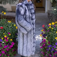 Our full-length natural silver fox coat offers unmatched elegance and warmth. The lush fur showcases stunning silver tones and softness. The natural silver fox trim adds texture and luxury. This coat keeps you cozy while making a bold style statement. It’s perfect for adding sophistication to any winter look.