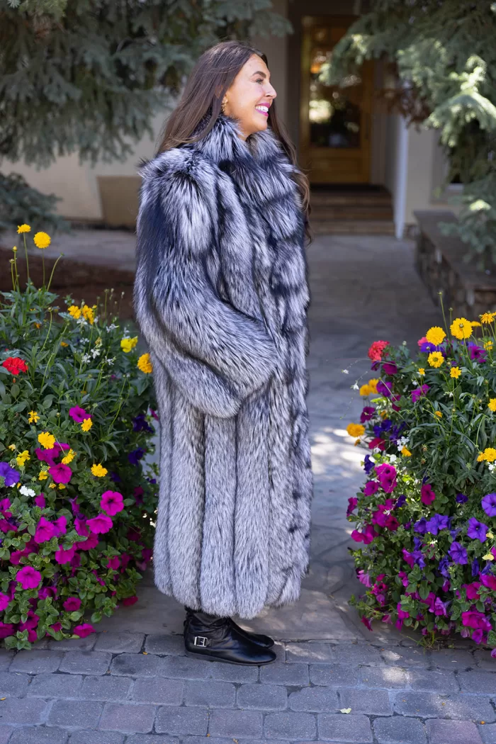 Our full-length natural silver fox coat offers unmatched elegance and warmth. The lush fur showcases stunning silver tones and softness. The natural silver fox trim adds texture and luxury. This coat keeps you cozy while making a bold style statement. It’s perfect for adding sophistication to any winter look.