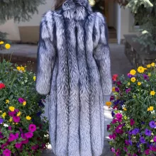 Our full-length natural silver fox coat offers unmatched elegance and warmth. The lush fur showcases stunning silver tones and softness. The natural silver fox trim adds texture and luxury. This coat keeps you cozy while making a bold style statement. It’s perfect for adding sophistication to any winter look.