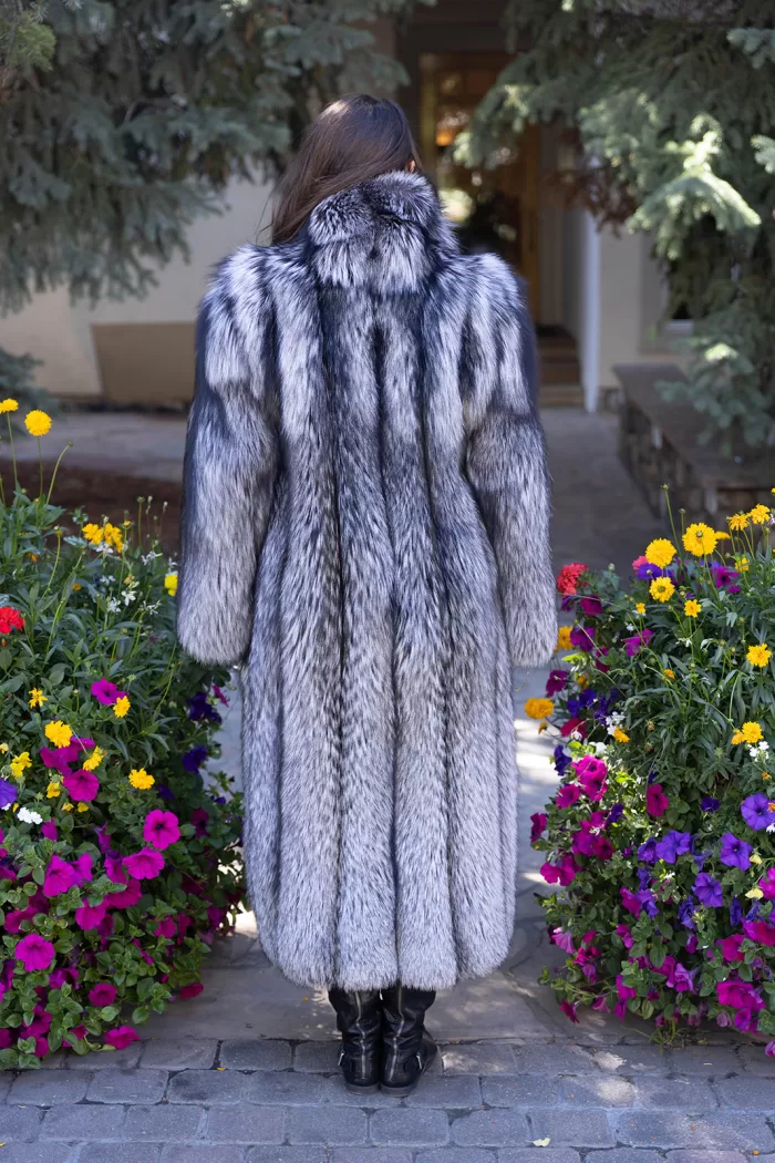 Our full-length natural silver fox coat offers unmatched elegance and warmth. The lush fur showcases stunning silver tones and softness. The natural silver fox trim adds texture and luxury. This coat keeps you cozy while making a bold style statement. It’s perfect for adding sophistication to any winter look.