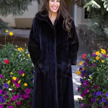 This dyed black ranch mink coat showcases sleek style and warmth. The rich black fur adds elegance to any outfit. Additionally, its soft texture ensures comfort for all occasions.