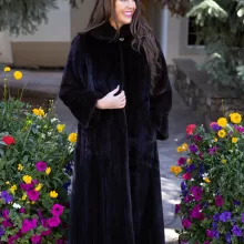 This dyed black ranch mink coat showcases sleek style and warmth. The rich black fur adds elegance to any outfit. Additionally, its soft texture ensures comfort for all occasions.