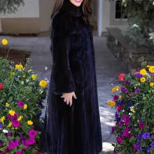 This dyed black ranch mink coat showcases sleek style and warmth. The rich black fur adds elegance to any outfit. Additionally, its soft texture ensures comfort for all occasions.