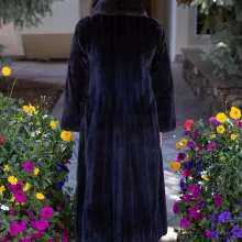 This dyed black ranch mink coat showcases sleek style and warmth. The rich black fur adds elegance to any outfit. Additionally, its soft texture ensures comfort for all occasions.