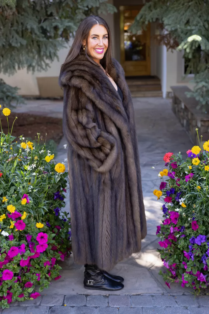 This natural Russian sable coat exudes luxury and warmth. Furthermore, its rich, soft fur offers unmatched comfort and timeless elegance. The classic design complements both formal and casual outfits. This coat is a perfect choice for any winter occasion.