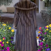 This natural Russian sable coat exudes luxury and warmth. Furthermore, its rich, soft fur offers unmatched comfort and timeless elegance. The classic design complements both formal and casual outfits. This coat is a perfect choice for any winter occasion.