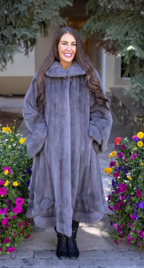 Our dyed blue iris mink swing coat adds elegance and movement to your wardrobe. The rich blue iris mink creates a luxurious look, while the swing design offers a graceful silhouette. This coat keeps you warm and stylish, making it a perfect choice for any occasion.