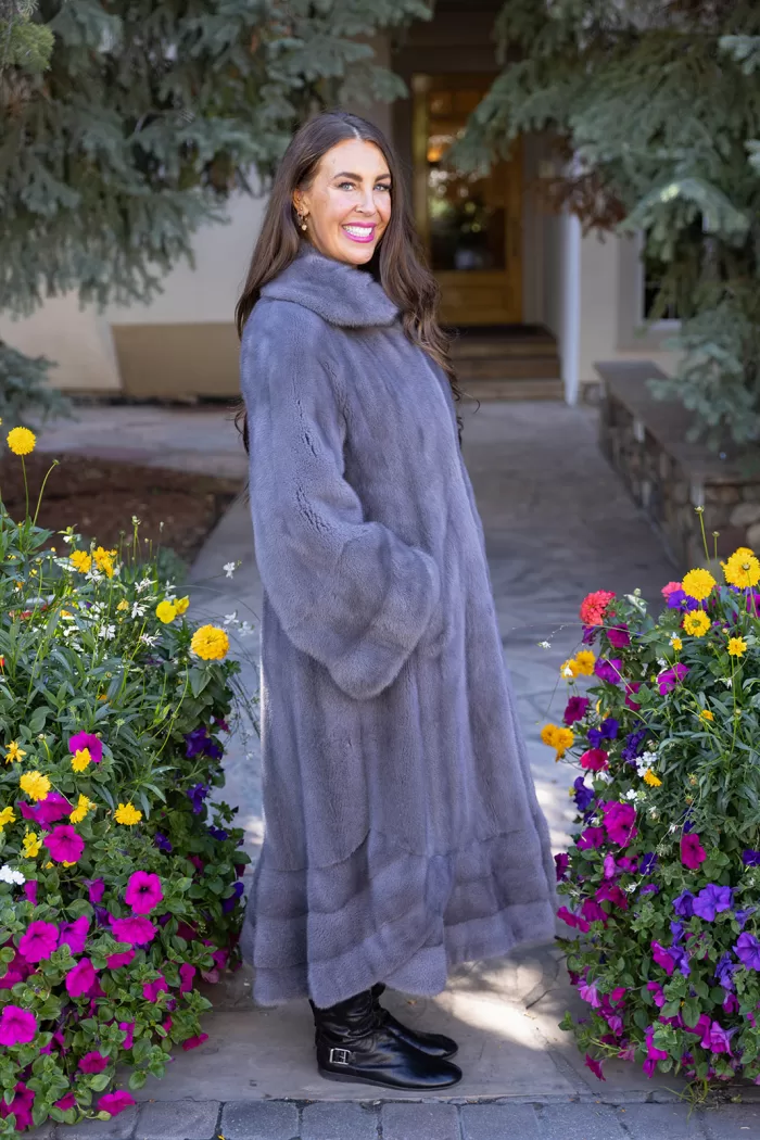 Our dyed blue iris mink swing coat adds elegance and movement to your wardrobe. The rich blue iris mink creates a luxurious look, while the swing design offers a graceful silhouette. This coat keeps you warm and stylish, making it a perfect choice for any occasion.