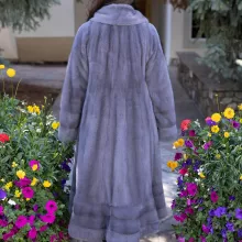 Our dyed blue iris mink swing coat adds elegance and movement to your wardrobe. The rich blue iris mink creates a luxurious look, while the swing design offers a graceful silhouette. This coat keeps you warm and stylish, making it a perfect choice for any occasion.