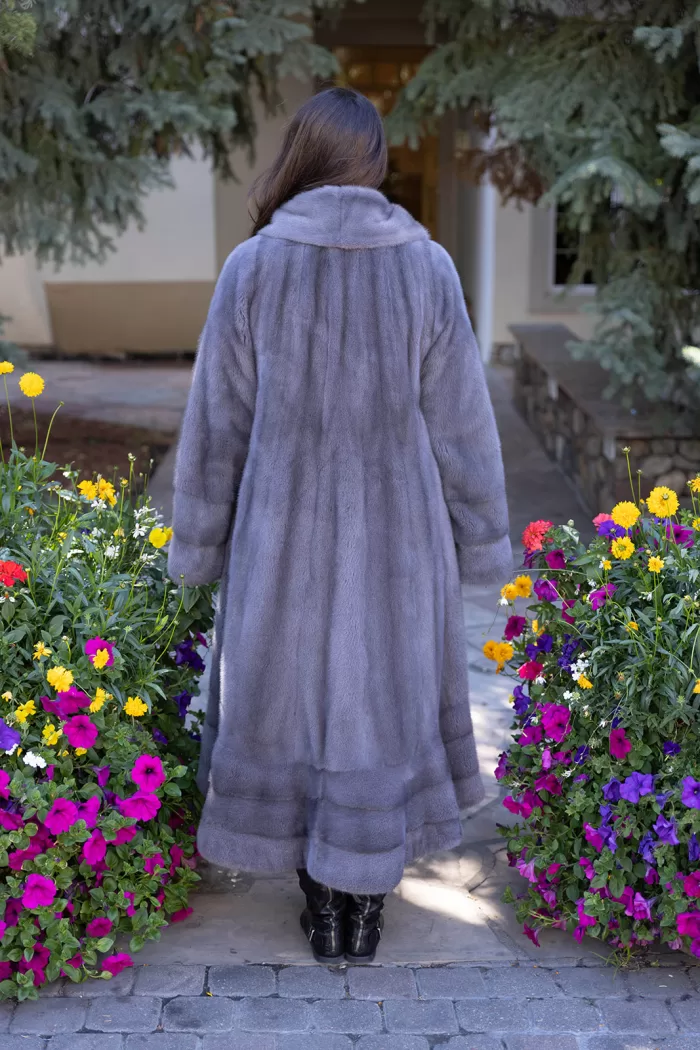 Our dyed blue iris mink swing coat adds elegance and movement to your wardrobe. The rich blue iris mink creates a luxurious look, while the swing design offers a graceful silhouette. This coat keeps you warm and stylish, making it a perfect choice for any occasion.