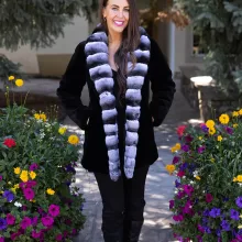 Our black reversible sheared mink coat with chinchilla trim combines luxury and versatility. The sheared mink offers softness and elegance. The chinchilla trim adds texture and sophistication. Its reversible design lets you switch styles effortlessly. This coat keeps you warm while enhancing your look for any occasion.