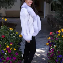 This natural sapphire cross mink jacket with platinum fox trim showcases luxurious style and warmth. The sapphire cross mink fur creates a stunning pattern, while the platinum fox trim adds a soft, elegant contrast. This jacket elevates any outfit, making it a perfect choice for those seeking sophistication and comfort.