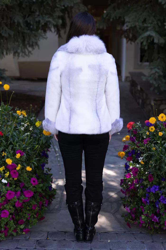 This natural sapphire cross mink jacket with platinum fox trim showcases luxurious style and warmth. The sapphire cross mink fur creates a stunning pattern, while the platinum fox trim adds a soft, elegant contrast. This jacket elevates any outfit, making it a perfect choice for those seeking sophistication and comfort.