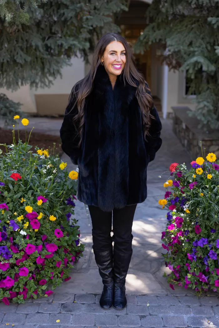 Our black reversible mink coat with fox tuxedo trim combines luxury and practicality. On one side, the sleek black mink fur offers warmth and elegance. While on the other side, the reversible design provides a versatile alternative. The fox tuxedo trim adds a bold and refined touch. As a result, this coat becomes a stylish choice for any occasion.