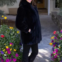 Our black reversible mink coat with fox tuxedo trim combines luxury and practicality. On one side, the sleek black mink fur offers warmth and elegance. While on the other side, the reversible design provides a versatile alternative. The fox tuxedo trim adds a bold and refined touch. As a result, this coat becomes a stylish choice for any occasion.