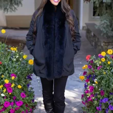 Our black reversible mink coat with fox tuxedo trim combines luxury and practicality. On one side, the sleek black mink fur offers warmth and elegance. While on the other side, the reversible design provides a versatile alternative. The fox tuxedo trim adds a bold and refined touch. As a result, this coat becomes a stylish choice for any occasion.