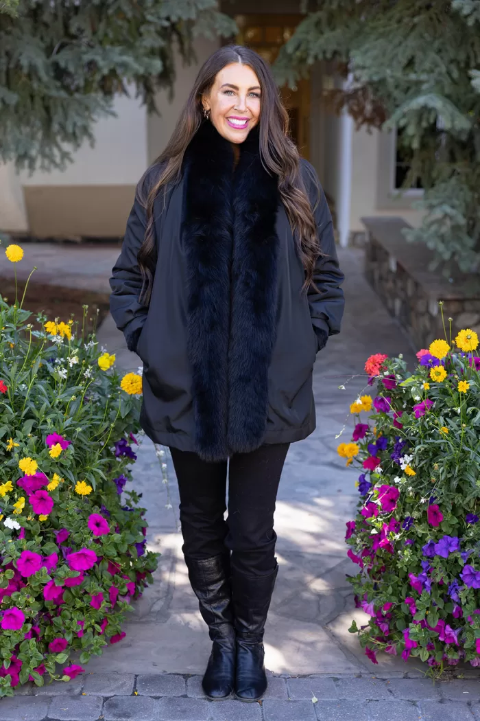 Our black reversible mink coat with fox tuxedo trim combines luxury and practicality. On one side, the sleek black mink fur offers warmth and elegance. While on the other side, the reversible design provides a versatile alternative. The fox tuxedo trim adds a bold and refined touch. As a result, this coat becomes a stylish choice for any occasion.