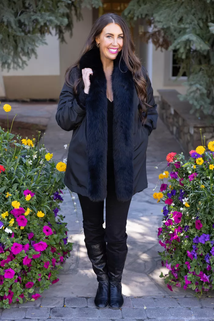 Our black reversible mink coat with fox tuxedo trim combines luxury and practicality. On one side, the sleek black mink fur offers warmth and elegance. While on the other side, the reversible design provides a versatile alternative. The fox tuxedo trim adds a bold and refined touch. As a result, this coat becomes a stylish choice for any occasion.