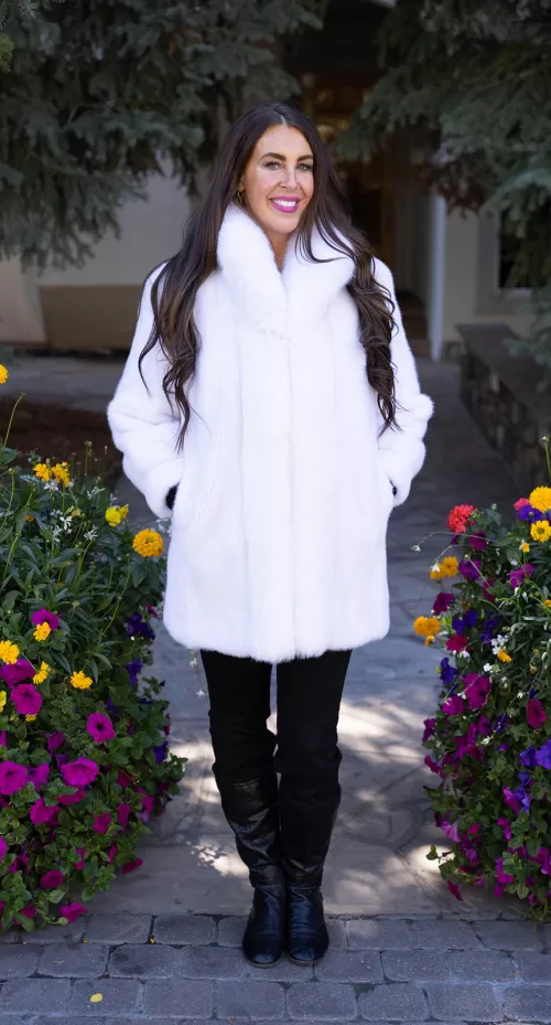 White reversible mink coat with soft texture and plush fox trim, featuring a relaxed fit by Fantasia Furs.